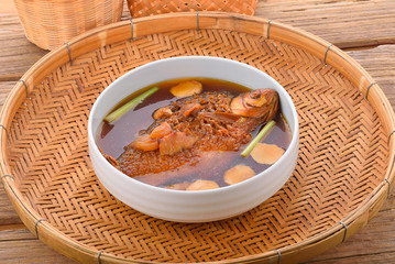 Boiled Thai fish on wooden background