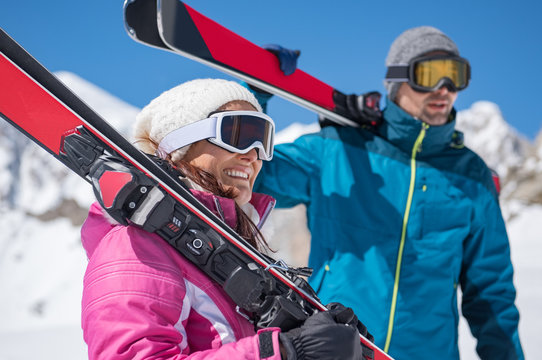 Couple holding ski