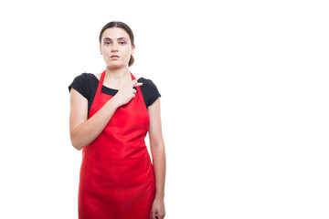 Serious female clerk doing a fake promise