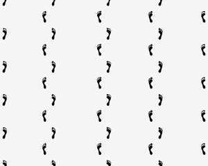 Prints of human feet on a white background, seamless