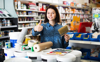 Woman in paint supplies store