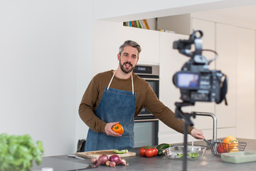 Adult male chef recording a video blog