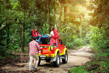 Travel Group of Young Asian Backpacker Enjoy Road Trip on 4WD Off Road Adventure in the Forest in Thailand - Holiday Concept