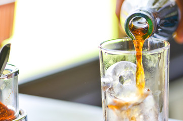 Cola drop in glass on holliday time