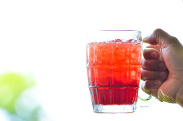 Red water and ice in a glass