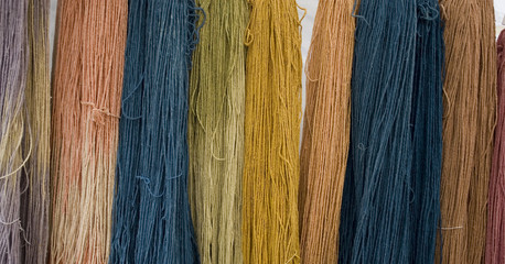 Background: flax fiber hank (birch), pink, lilac, beige, yellow, green, peach, obtained with...