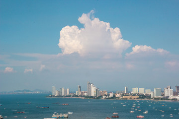 Pattaya city and many boats and ferry in the sea