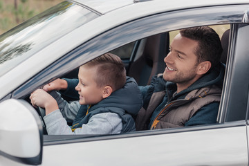 father and son in car