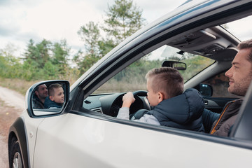 father and son in car