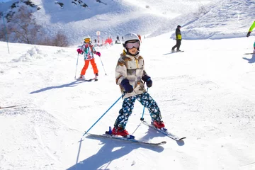 Acrylic prints Winter sports kids on alpin ski resort