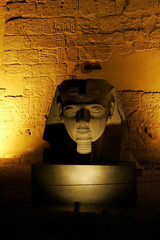 Fototapeta na wymiar Pharaoh's bust at Luxor temple at night