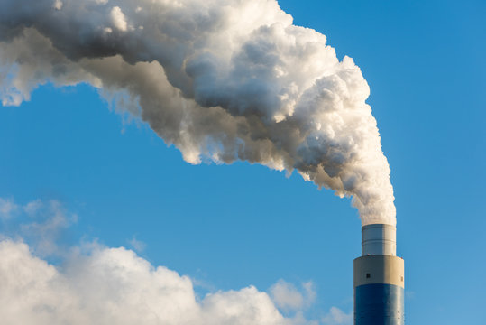 The smoking chimney of a coal power plant