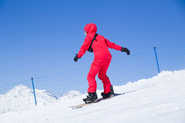 Fototapeta na wymiar snowboarder skating in ski resort
