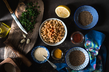 Ingredients for cooking falafel, chickpeas, tahini and spices