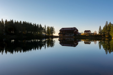 Fototapeta premium Autumn landscape - Black Forest. A small lake in the high mountains of the Black Forest in autumn.