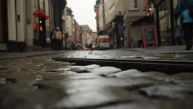 Cobblestones and rails in street in historic Antwerp, Belgium.