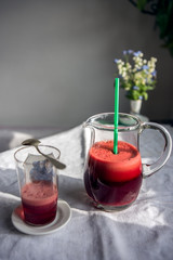 Cold pressed red beet juice in the morning light