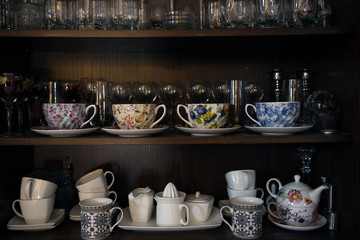 Tea utensils, coffee and beverages on the shelves