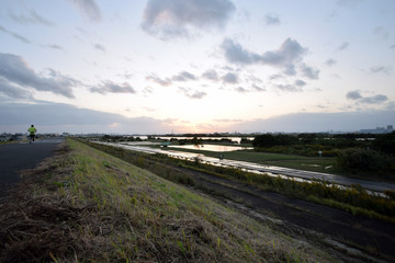 Fototapeta premium A river and the setting sun after the typhoon.