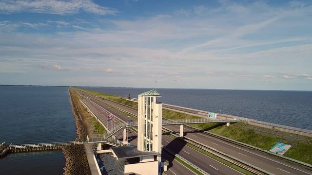 Observation tower and long dike in Holland. Aerial riser.