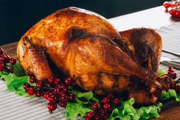 Baked turkey on salad leaves with cranberries