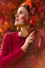 Beautiful woman in the autumn park