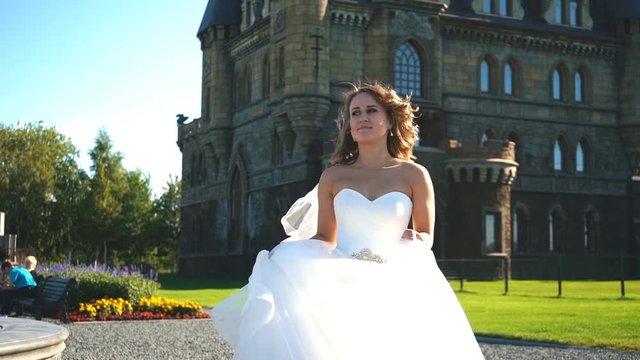 beautiful blonde bride goes on camera and posing