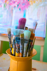 Paint brushes in a jar