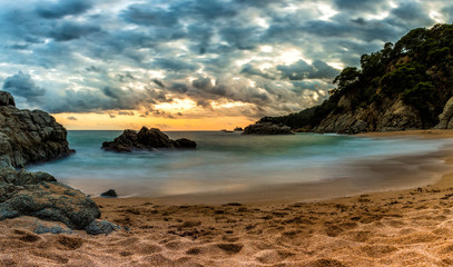Fototapeta na wymiar Sunset on a beach of LLorert de Mar on the Costa Brava