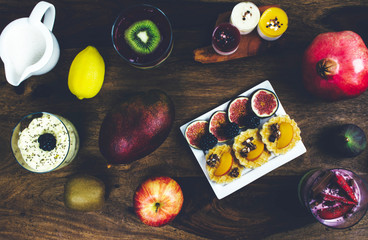 Healthy breakfast set on rustic wooden table.