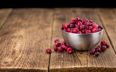 Some fresh Dried Cranberries (selective focus; close-up shot)