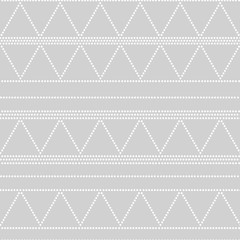Doted triangle geometric seamless pattern on grey, vector