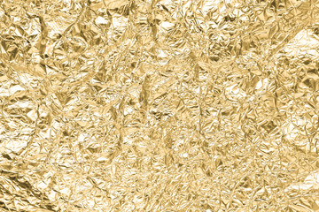 Gold wrinkled paper texture abstract background