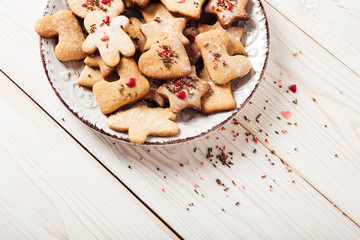 Gingerbread plate,bow.Christmas,holiday and new year concept.Wooden table.Top view.