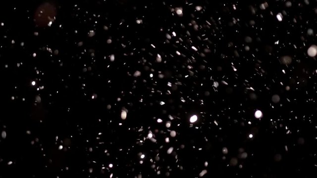 Realistic Glitter Exploding on Black Background. These clips are perfect for visual effects, compositing, and motion graphics. Use blending mode (screen).
