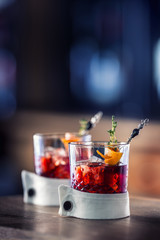 Fresh cocktail drink with ice fruit and herb decoration. Alcoholic, non-alcoholic drink-beverage at the bar counter in the pub restaurant  or night club