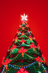 Christmas tree lights, red background