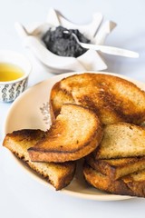Fried bread, black caviar and cup of tea.
