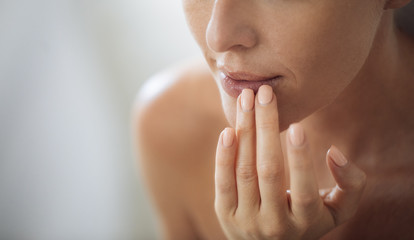 Woman Applying Moisturising Balm on Her Lips
