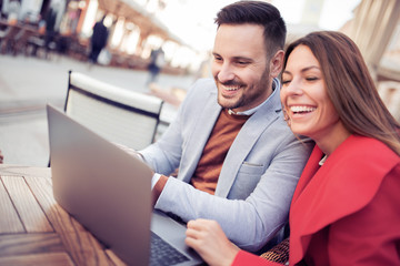Happy couple sitting in cafe bar