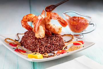 king prawns grilled with a side of red rice
