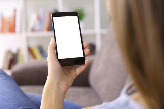 Woman using a smart phone with blank screen