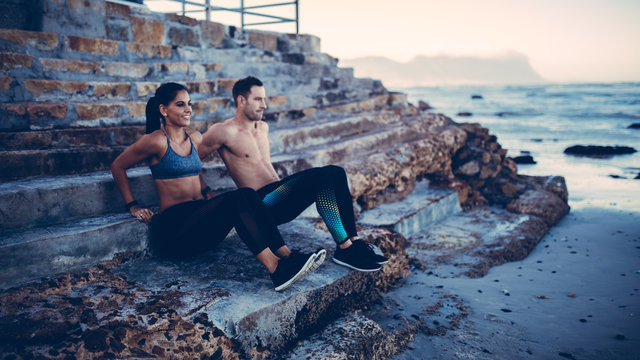 Adult Couple doing fitnessworkout at the beach