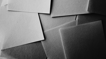 Minimal style papers in dark noir light room. Office supplies top view.