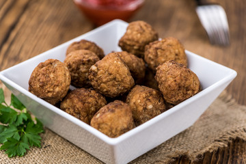 Meatballs (fresh made) as detailed close-up shot, selective focus)