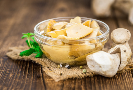 Fresh made Canned Porcinis on a rustic background