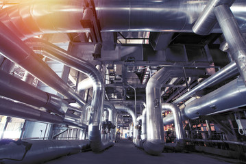 Equipment, cables and piping as found inside of a modern industrial power plant