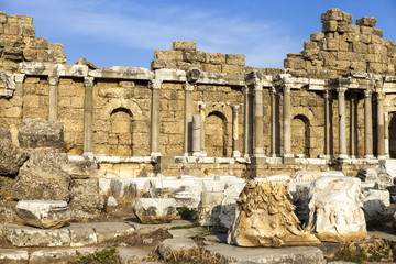 Fototapeta premium Beautiful old ruins on a Sunny summer day. Ruins of a Byzantine city, destroyed the house, columns, stones and walls with ornament.