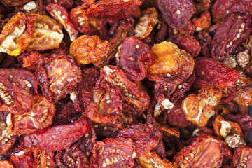 Dried Sicilian tomatoes closeup. Red tomatoes. Village market organic tomatoes.