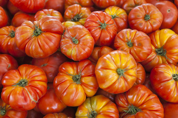 Village market organic tomatoes. Qualitative background from tomatoes. Fresh tomatoes. Red tomatoes.